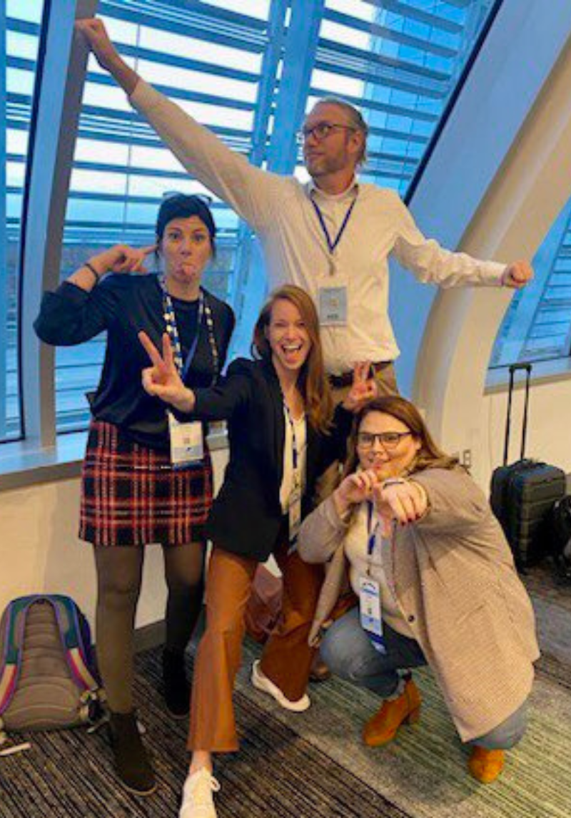4 attendees posing for an action shot at the 2022 VSTE Conference.