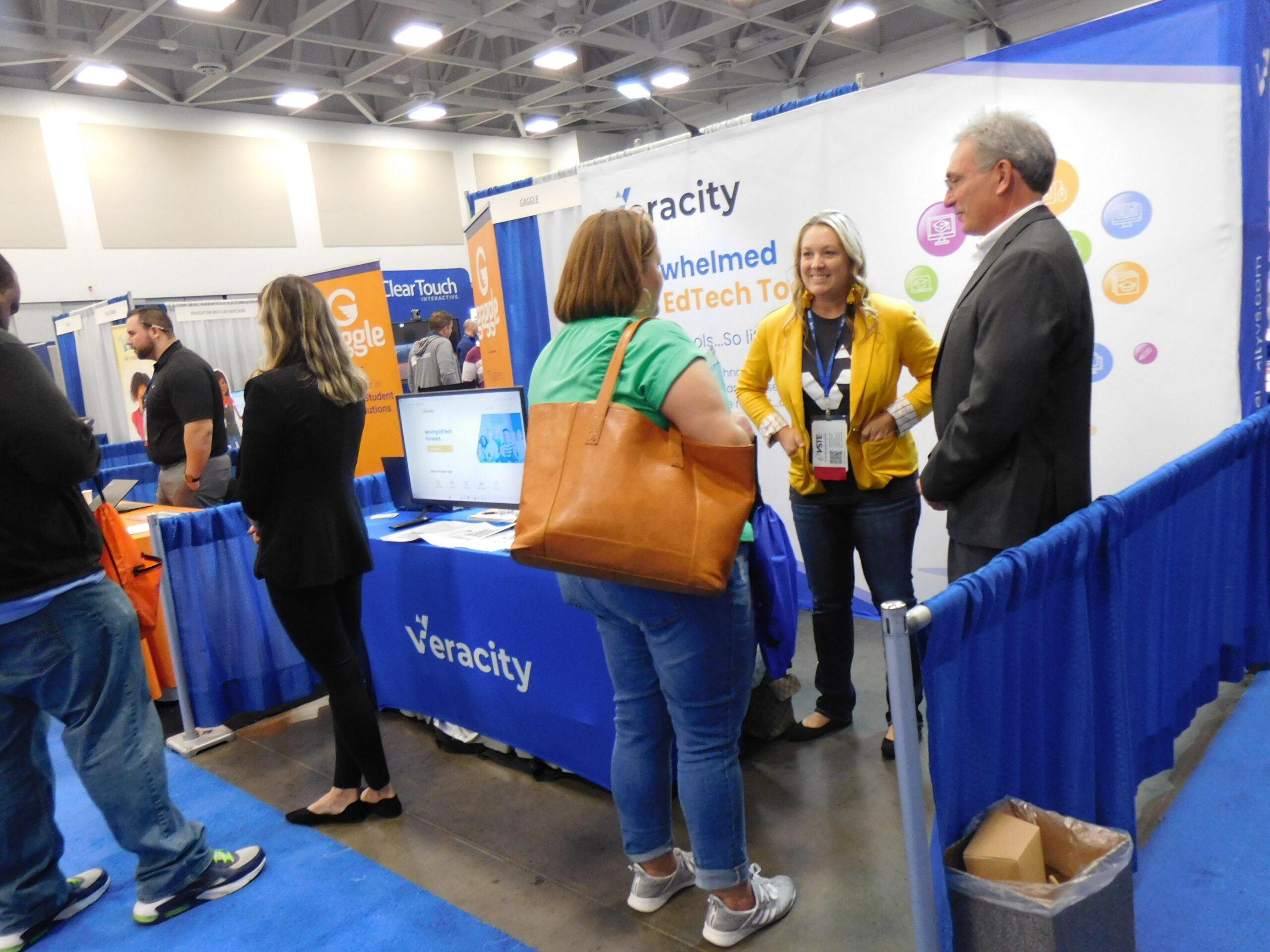 Conference attendees speaking with exhibitors at the 2022 conference. 