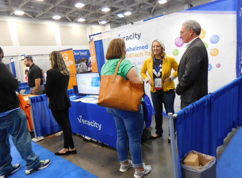 Veracity sponsors speaking to conference goers during the 2022 conference. 