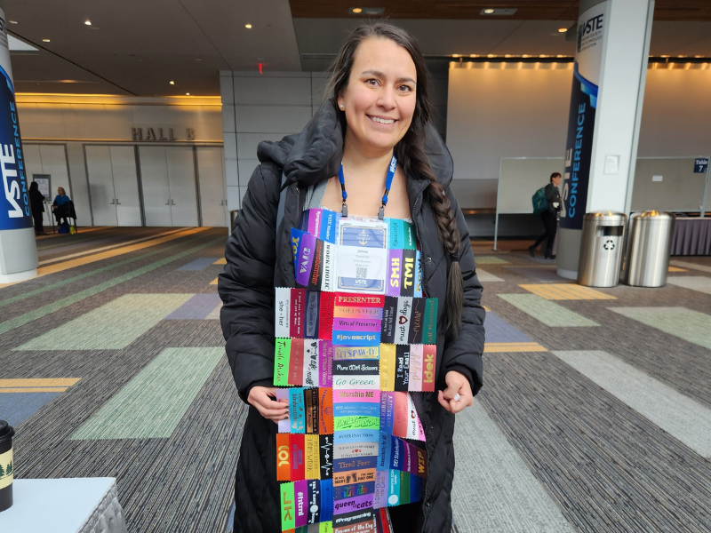 VSTE presenter dawning her abundant conference ribbon swag. 